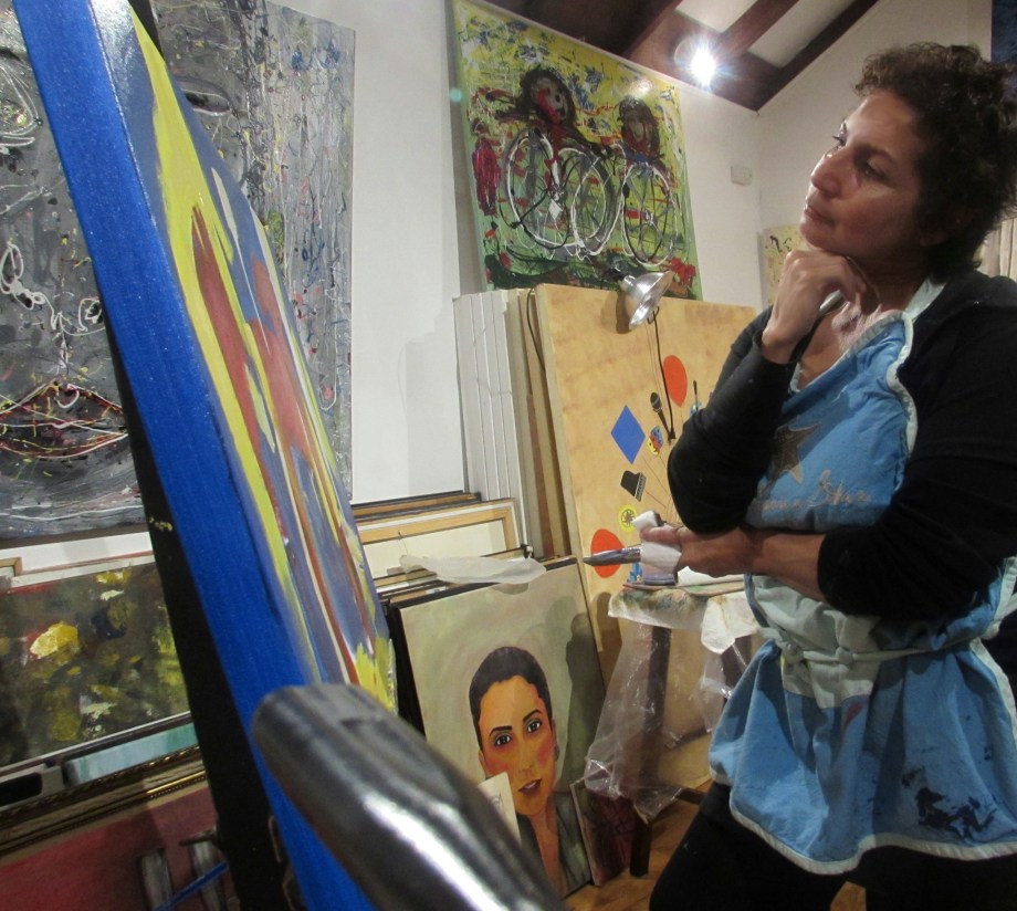 Rebecca looking at her painting